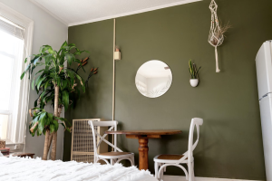 A sage green wall in a room