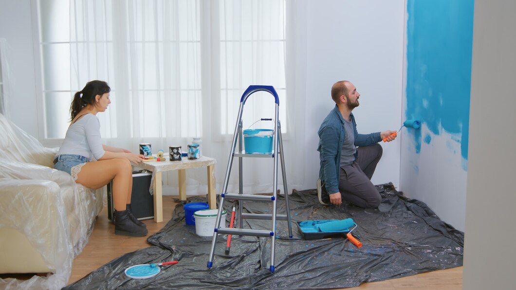 couple-conversation-home-renovation-roller-brush-dipped-blue-paint-apartment-redecoration-home-construction-while-renovating-improving-repair-decorating_482257-14161