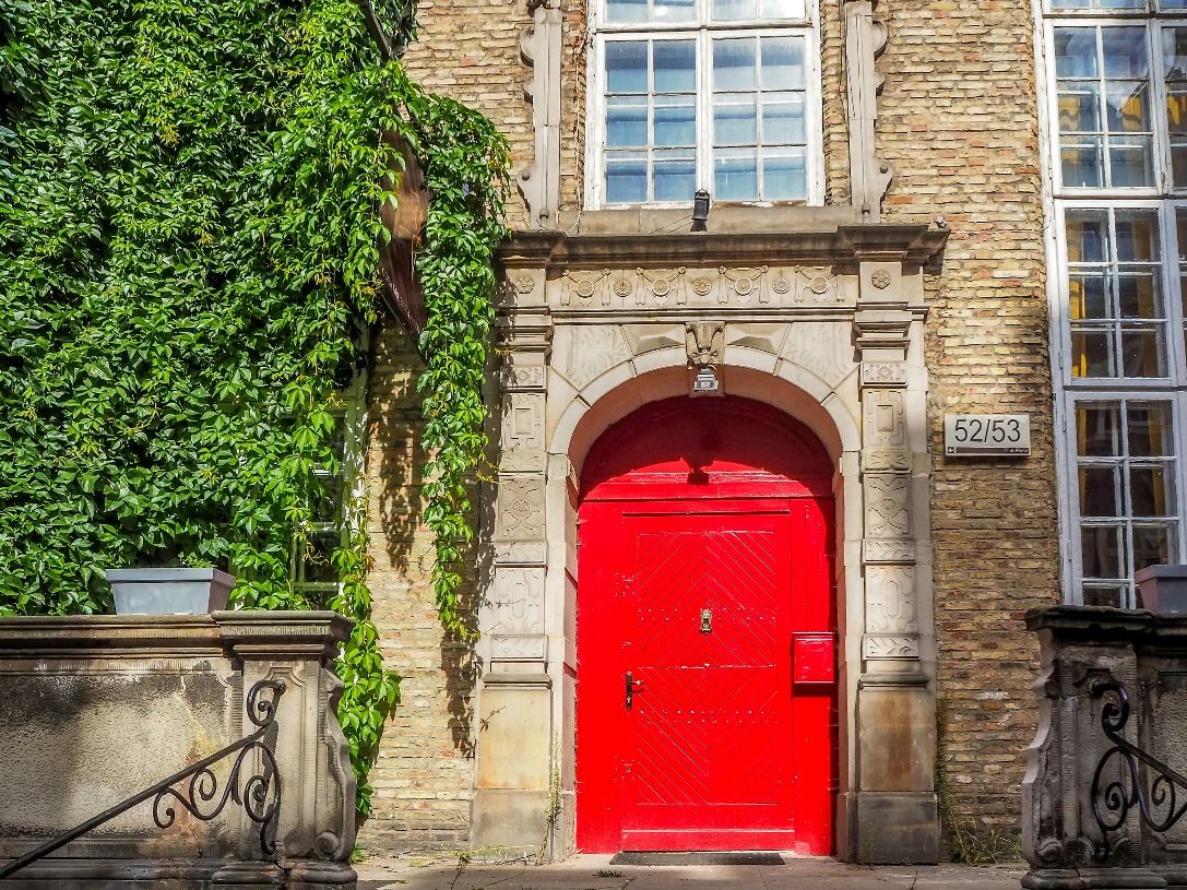 A contemporary house with a striking red door