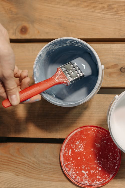 a person mixing paint.