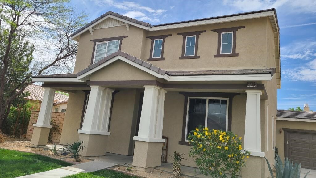 A house with a neutral beige exterior.