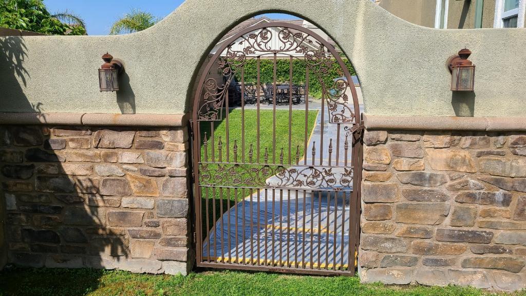 a gate between two brick walls