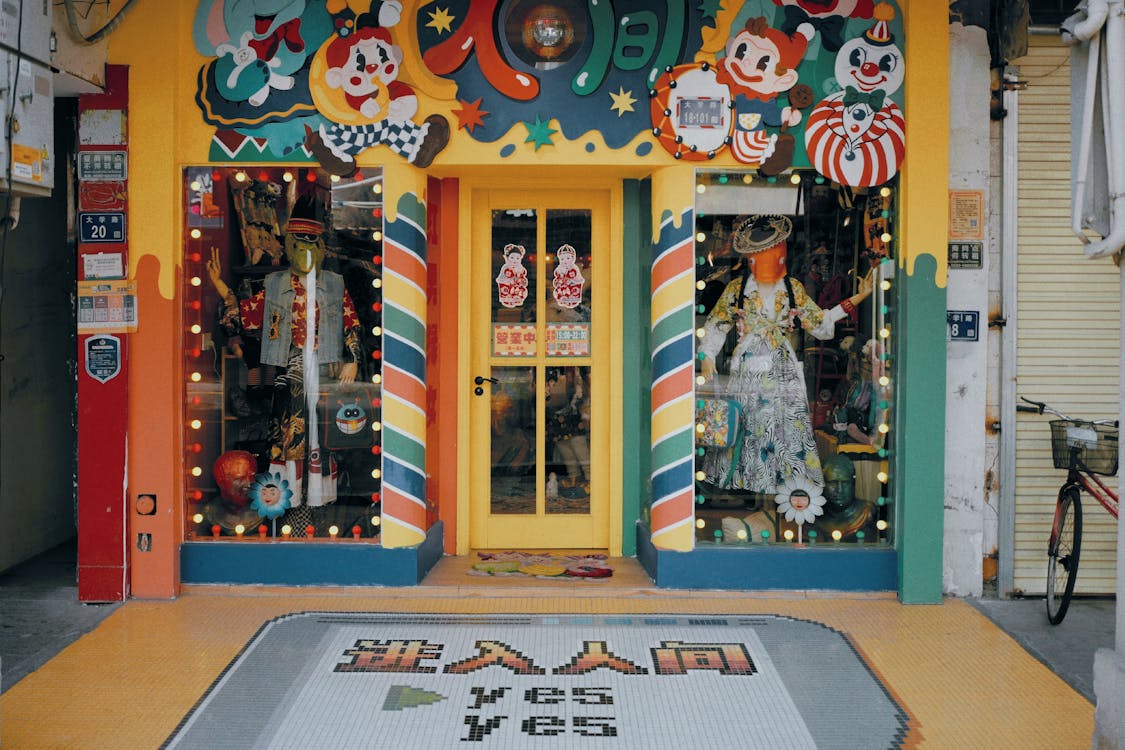 A toy store with a colorful, freshly painted front, showcasing vibrant colors that create an inviting appearance.