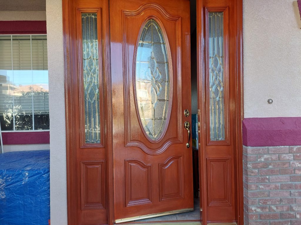 a freshly painted gate outside a house