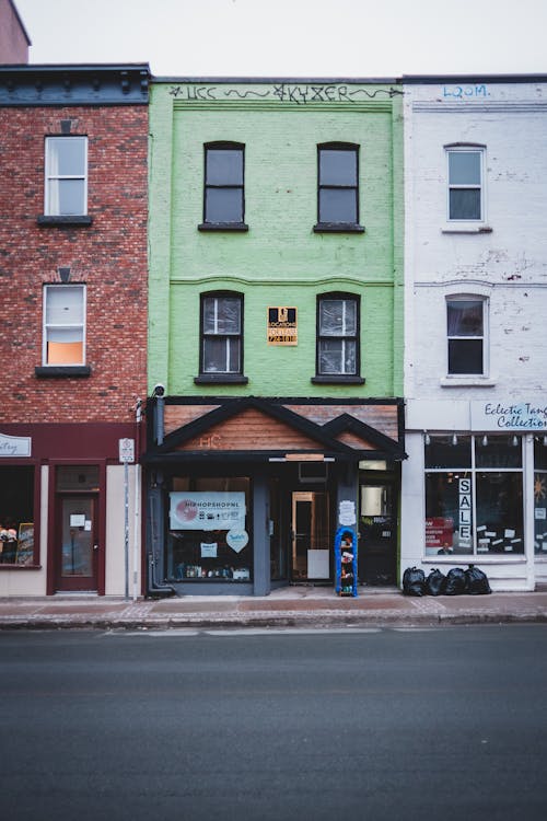 A row of colorful commercial buildings with freshly painted exteriors.