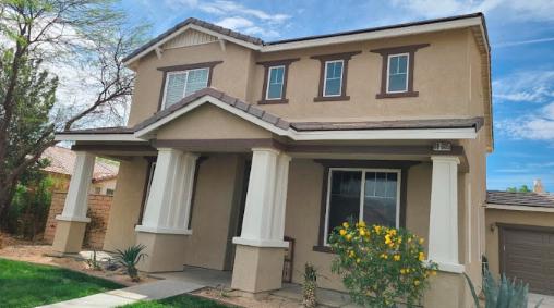 A newly painted house exterior with vibrant colors, completed by professional exterior house painters.