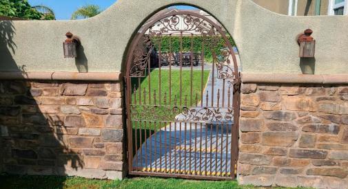 A freshly painted gateway enhancing the curb appeal of a home with vibrant and smooth exterior paint.