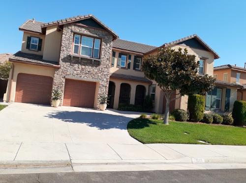 Exterior view of a freshly painted house showcasing the work of top exterior house painters.