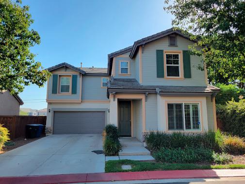 Front view of a freshly painted house with a vibrant exterior, completed by Silver Star Painting’s skilled exterior house painters.