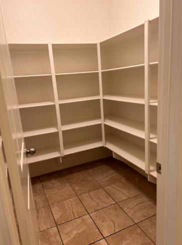 A freshly painted pantry, showcasing how a coat of paint can make a functional space feel fresh and inviting.