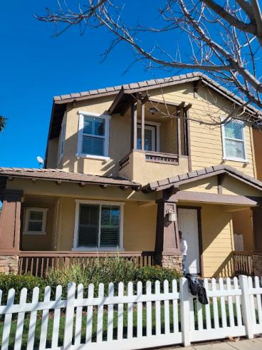 A residential property with freshly painted exterior walls, showcasing expert house painting work.