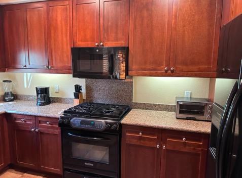 Bright and modern kitchen with a fresh coat of paint, achieved through meticulous surface preparation.