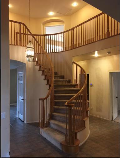 a staircase and a pendant light.