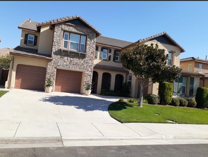 a home’s exterior with trees.