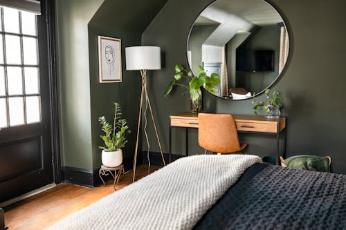 A grey accent wall in a modern bedroom.