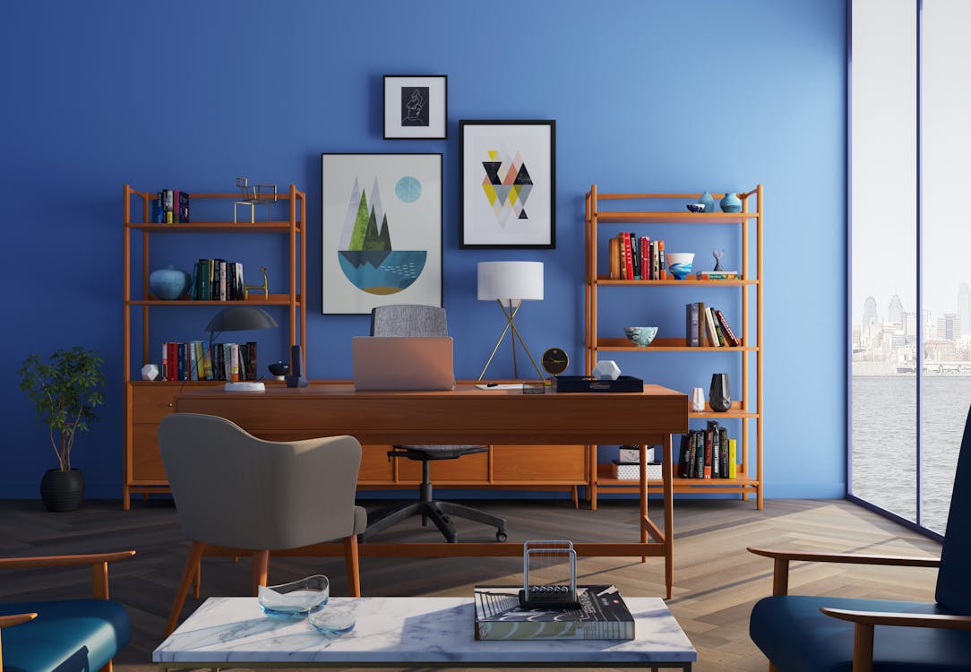 a home office with blue walls.