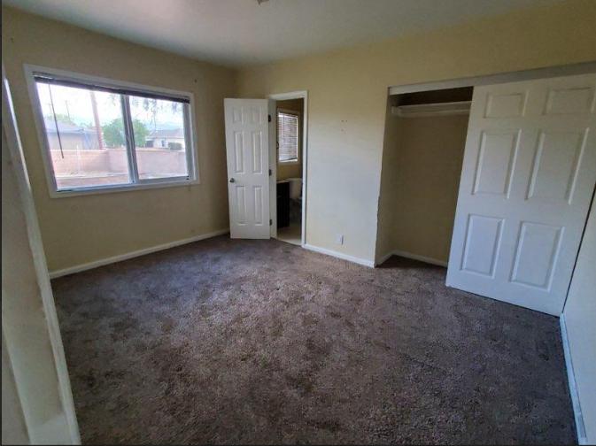 a room’s interior with carpeting.