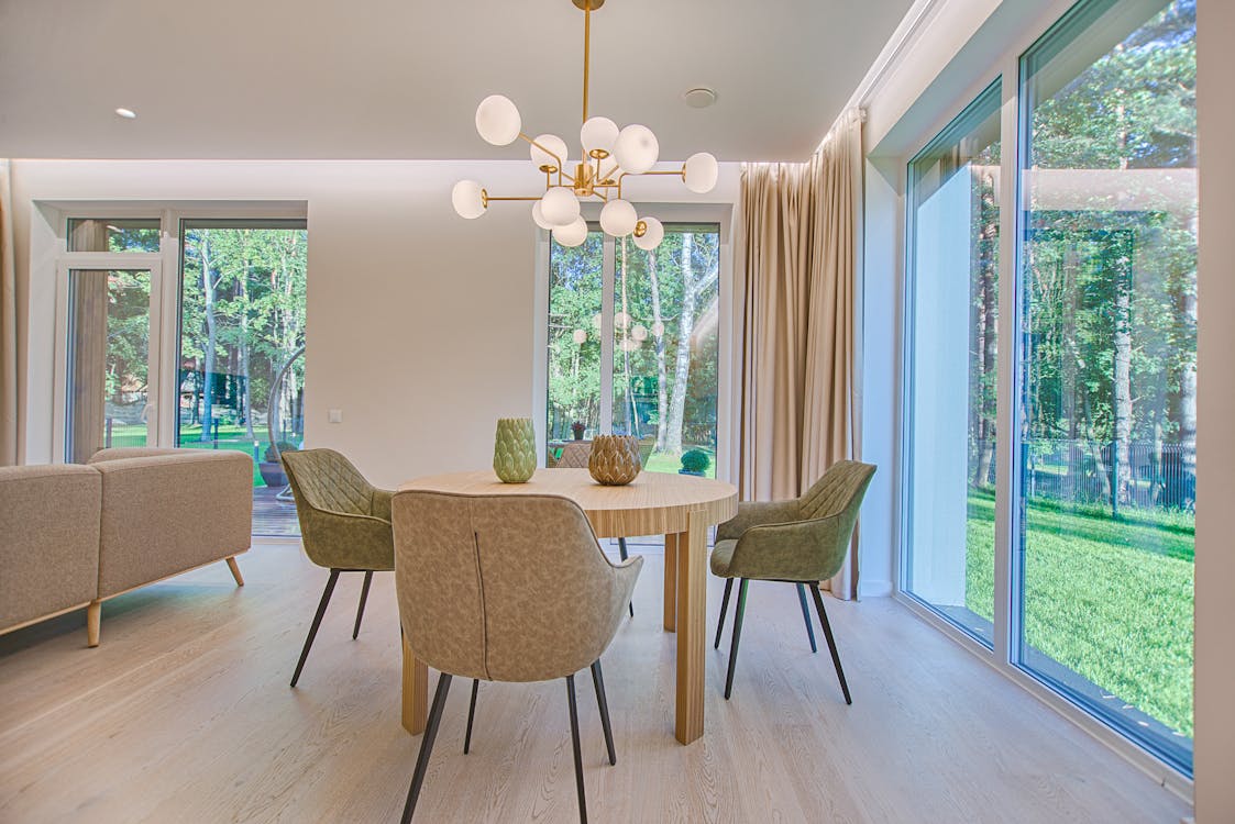 A dining table and chairs set featuring earthy tones