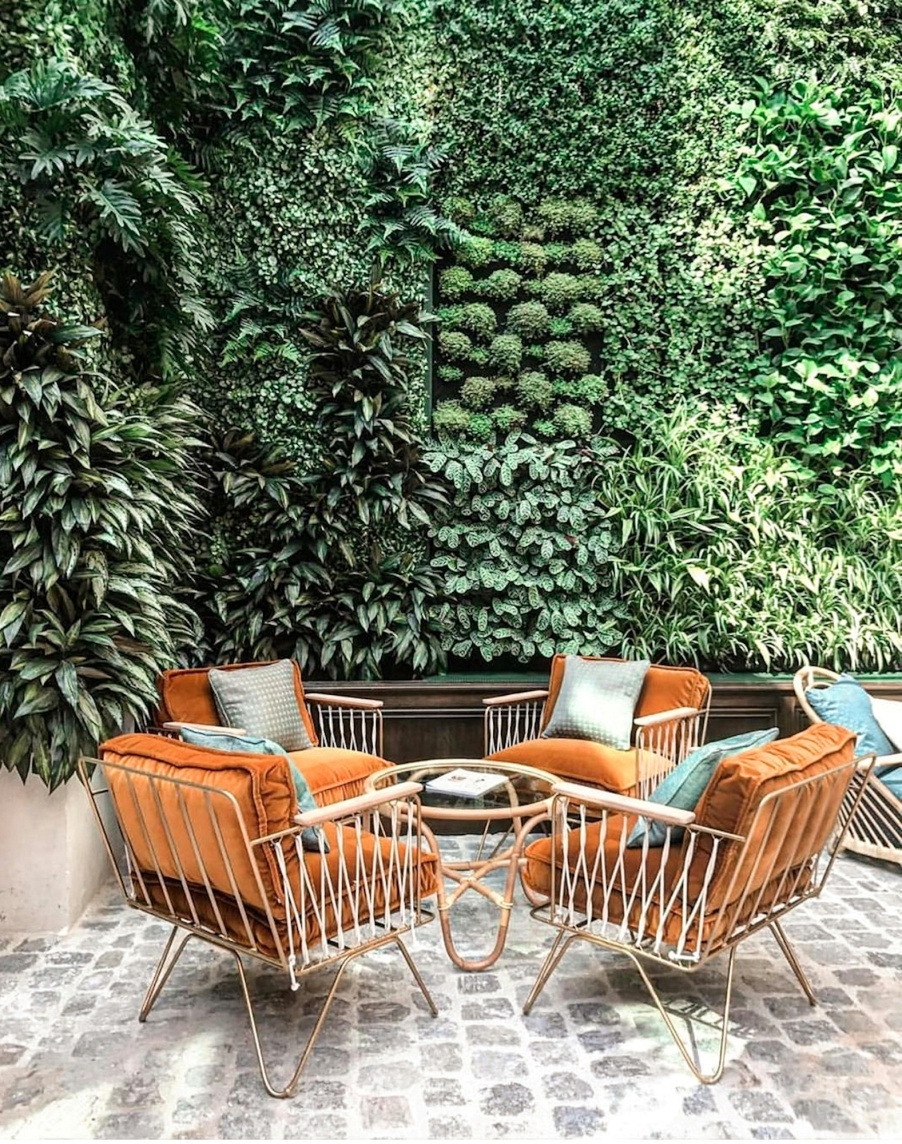 A patio with a vertical garden