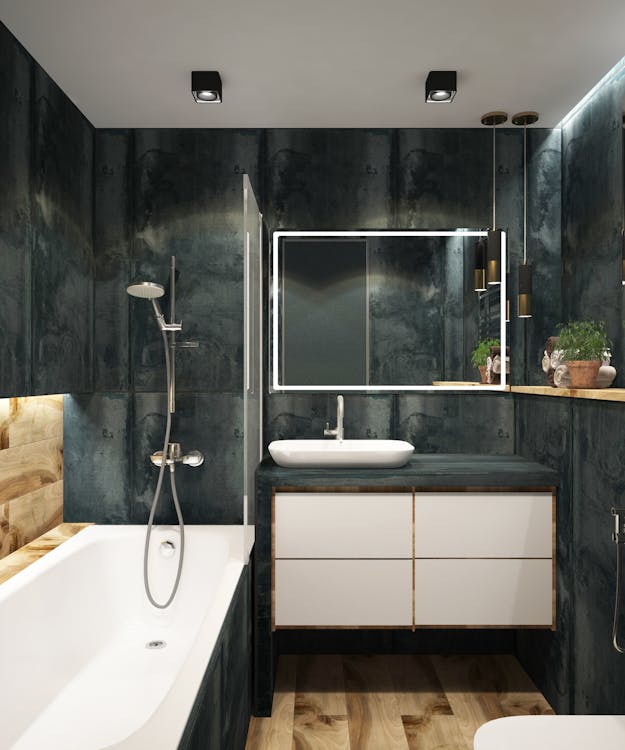 a bathroom space with gray walls.