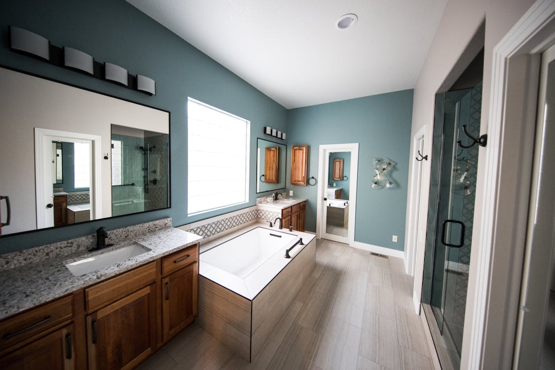 a bathroom with wooden cabinets.