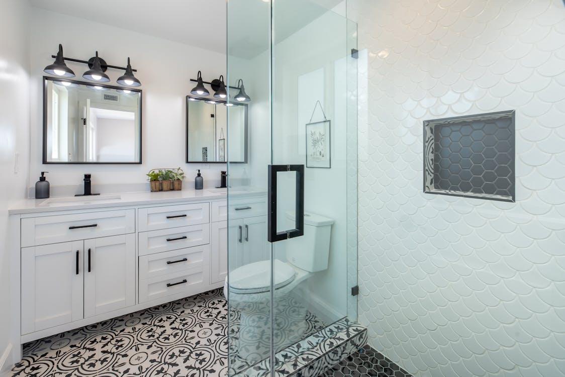 a bathroom space with glass doors.
