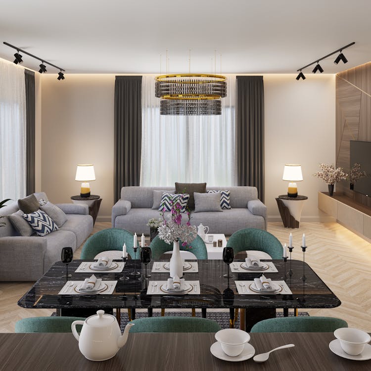 a room with gray couches.