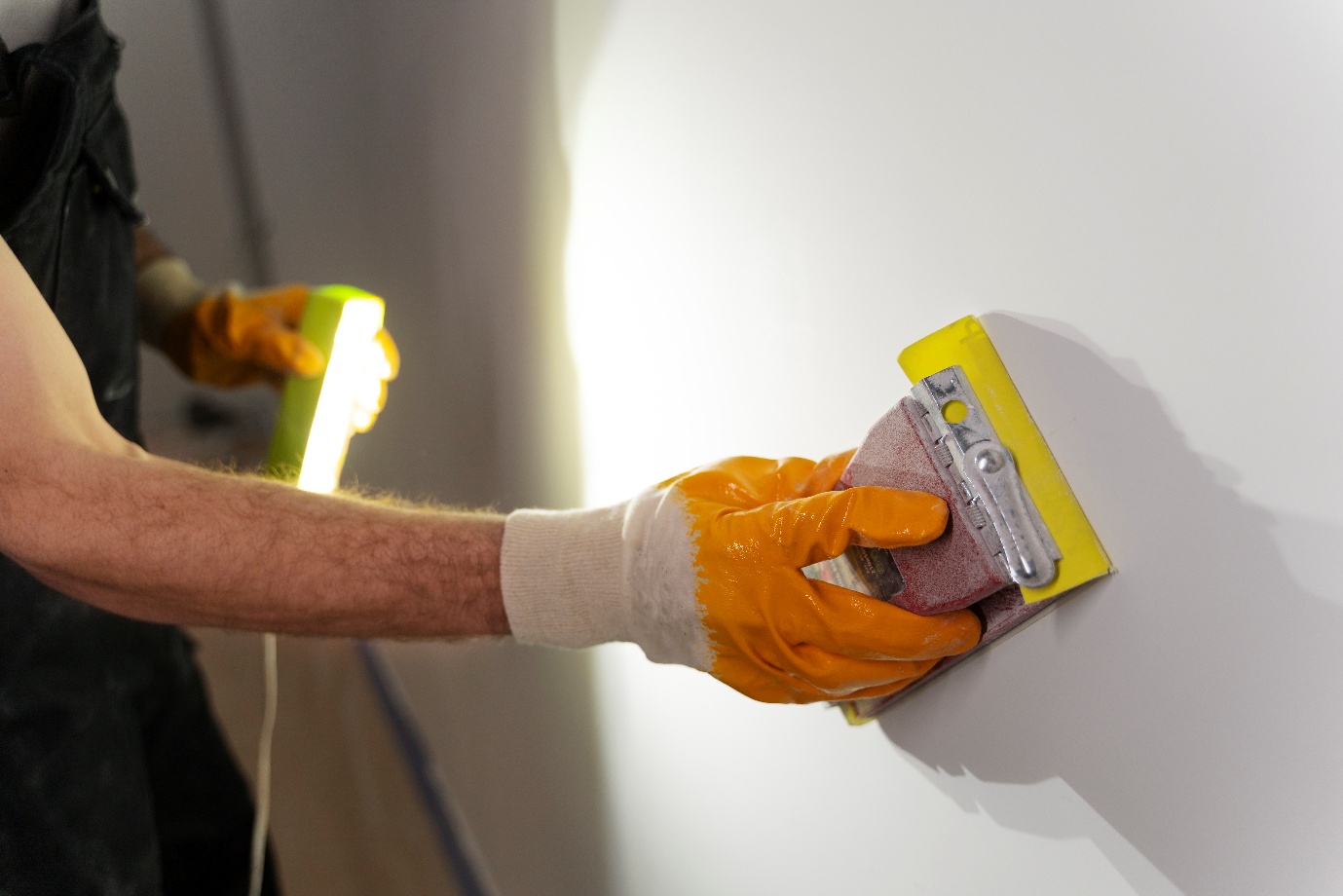 a contractor wearing protective gloves.