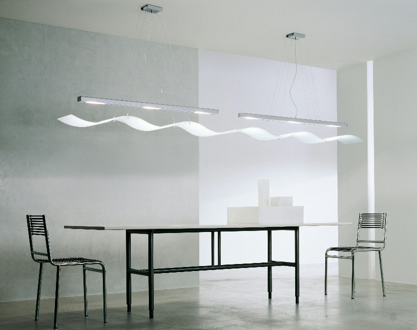 Modern lighting fixture floating over a table