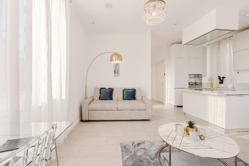 Minimally decorated living space with sunlight pouring through