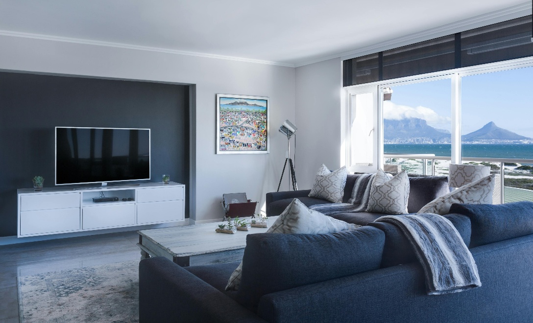 Bold blue interior design with big windows