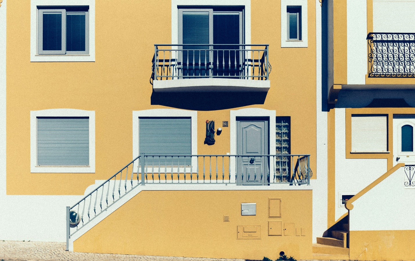 Freshly painted house showcasing smooth, vibrant walls after thorough surface preparation.