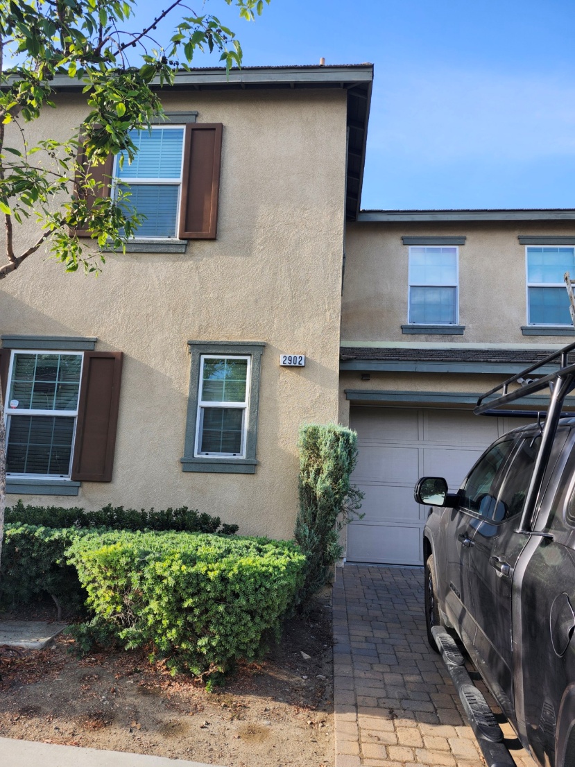 a car parked outside of a house.